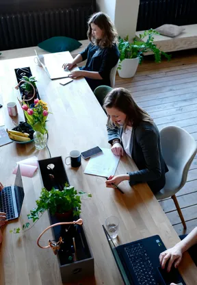 Team collaboration in modern workspace representing family offices